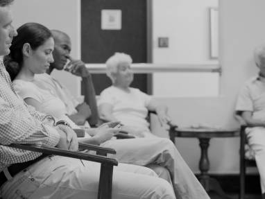 People sitting in waiting area with Regard chairs