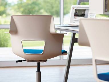 Rear-view of Shortcut chair at a workstation