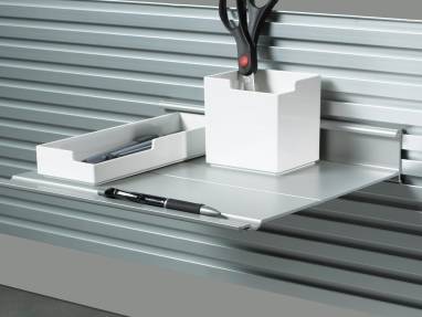 Slat wall holding a SOTO tool and utililty box
