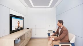 man having a virtual meeting inside a room