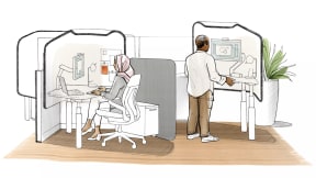 A woman and man working at adjustable workstations.