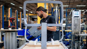 Factory worker in the assembly area of an industrial setting