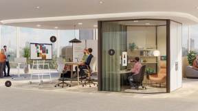 Hybrid workplace with collaborative meeting areas, presentation spaces and enclosed rooms supporting in-person and virtual teamwork.