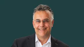Image showing a headshot of Dr. Thorsten Bagschik, Managing Director of SRH University of Applied Sciences, on a green background