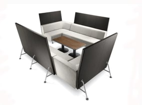 Black and white Bix Lounge System with a dark wood finish coffee table in the middle