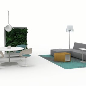Rendering of a common space with a grey Sistema Lounge, blue rug underneath, white personal table and a lamp next to it. Round white table with four Lox Chairs