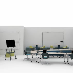 on white image of an education setting with polyvision A3 ceramicsteel whiteboard, Roam Mobile Stand, Orangebox Border, Splash Coat Rack, Turnstone Pouf seat, Shortcut chairs, Verb table, Bivi depot, Cubb stools