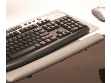 Close-Up of keyboard on a Grey Keyboard Platform with a mouse nearby