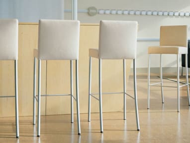 Four Off-White Switch Stools near a bar