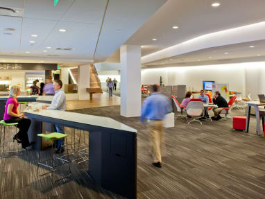A WorkCafe at Steelcase headquarters featuring SW_1 lounge seating and Last Minute stools from Coalesse