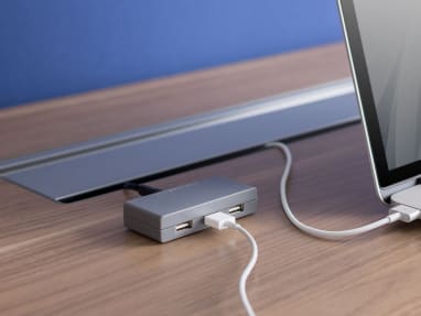 SOTO USB Charging Station next to a laptop