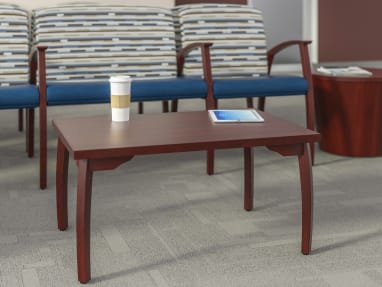 A Mitra Combination Unit of waiting room chairs behind a coffee table