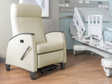 Cream Mitra Recliner next to a hospital bed
