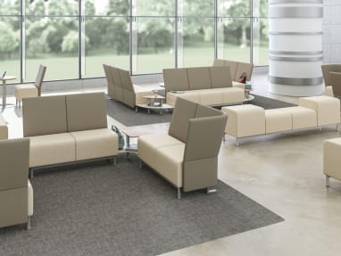 Neighbor lounge seating and benches in a large waiting room