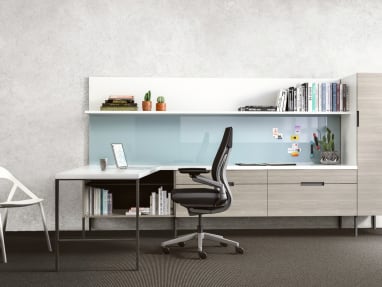 A Gesture desk chair and LessThanFive chair in an office with an Elective Elements workstation