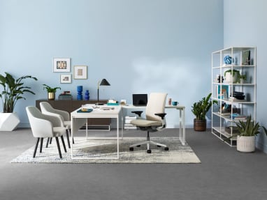 A West Elm Work Greenpoint private office with shelving, storage cabinet, West Elm Work Sterling chairs, and Steelcase Think desk chair