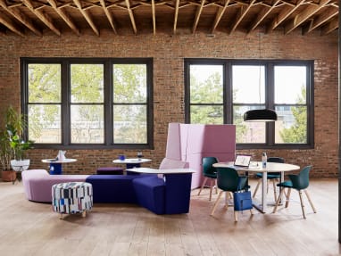 Social environment with Orangebox Away from the Desk lounge, Turnstone Alight ottoman, Verlay table, and Node Wave 6 chairs