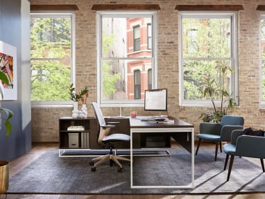 SILQ desk chair and Bolia C3 chairs next to a West Elm Work Greenpoint Private Office Desk