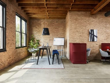 A meeting area for a larger group features a B-Free table and B-Free Beam with Nooi stools with individual work areas nearby created with Lagunitas Focus Nooks