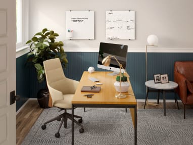 Home office space equipped with PolyVision Nota whiteboards, a beige Massaud Conference chair and a wooden desk.