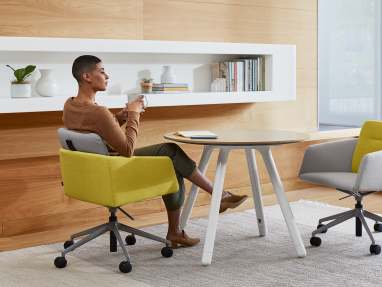 woman seated on a Marien152 Seating Collection and Potrero415 Light Table Cafe