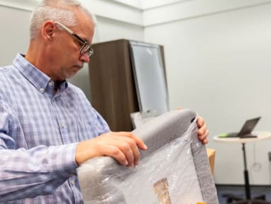 man holding a brand new Screen