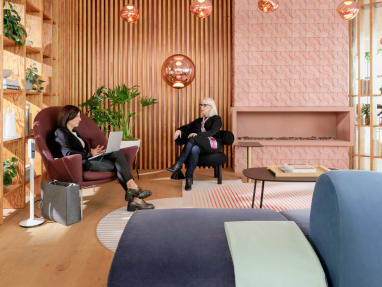 two people in a meeting at an open space