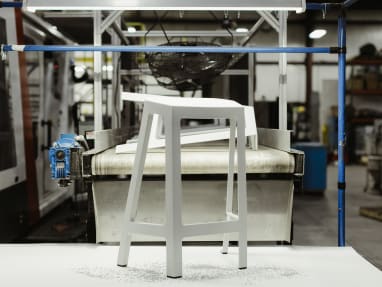 white Flex perch stool in a manufacturing plant