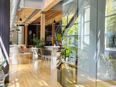 Impact Report image that shows an office shared space in warm and natural tones