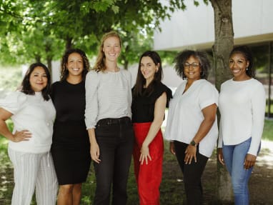 group of 6 women posing for the picture in a yard