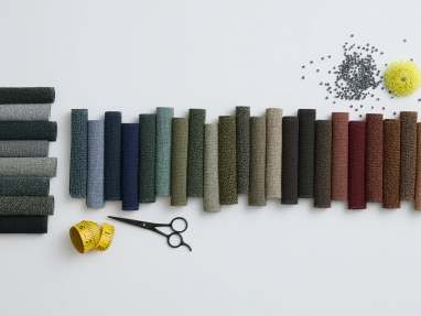 A selection of Amaze Loop material in different colors, on a gray background