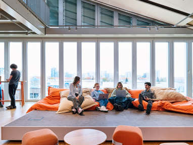 SRH University students in a lounge environment