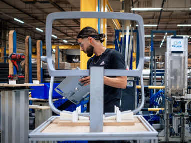 Factory worker in the assembly area of an industrial setting