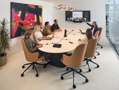 Ocular™ Sightline Conference Table in a meeting room environment with people