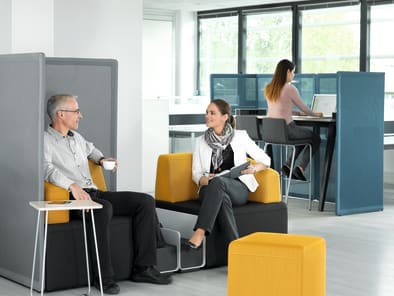 Steelcase employees sitting in B-Free soft seating