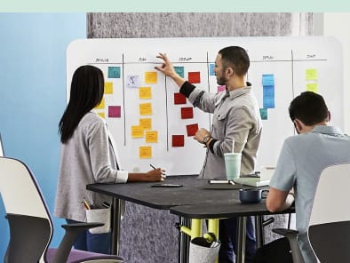 Webinar: Empowering Innovative Teams 4 employees are working in open space