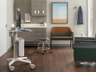 inside a medical exam room with a green Empath chair