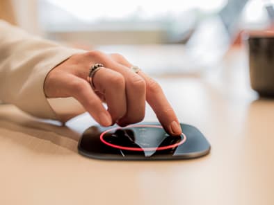 Close up of woman using the GoBright scheduling system