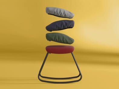 Steelcase Flex Rocker Stool on a yellow background with detachable cushions