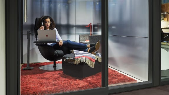 private work area with Massaud lounge and ottoman and small work table