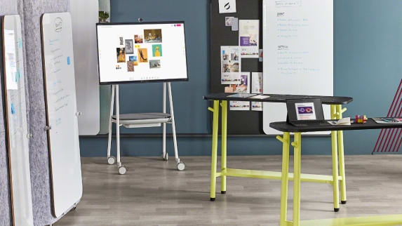 A Steelcase Roam Mobile Cart in a meeting room with Steelcase Flex standing height tables and Markerboards