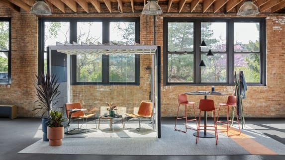 Enea Lottus bar-height stools are shown next to a Montara650 table beside an Orangebox Air23 pod with West Elm Slope Lounge Chairs and a Bolia Mix coffee table