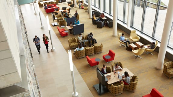 Students walking through a library