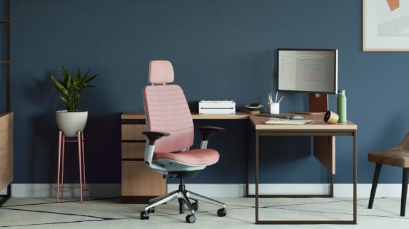 private office with a square wooden desk, metal legs and a pink Series 2 office chair with head rest
