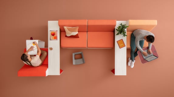 two people working at a campfire lounge application