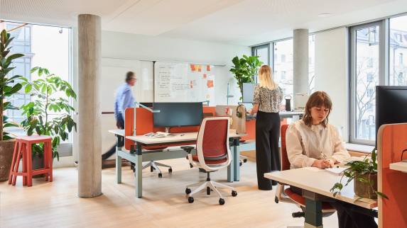 Small-Midsize Business banner showing people at their workstations.