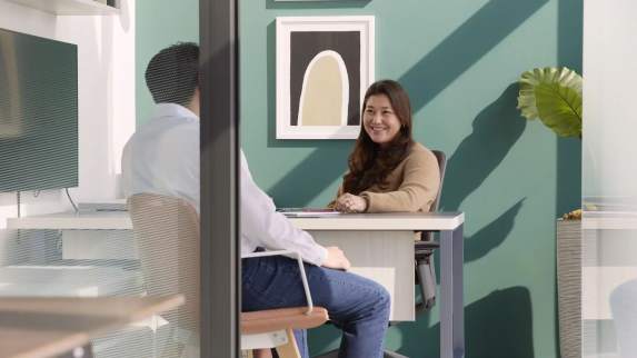 People having a meeting in an enclosed space