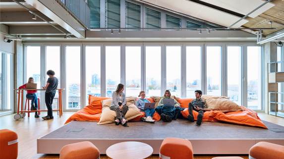 SRH University students in a lounge environment