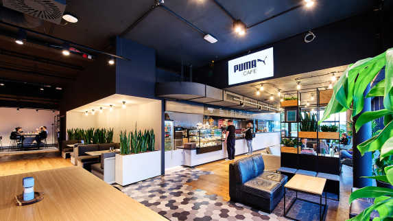 Inside the New Café at PUMA’s Global Headquarters showcasing Steelcase products
