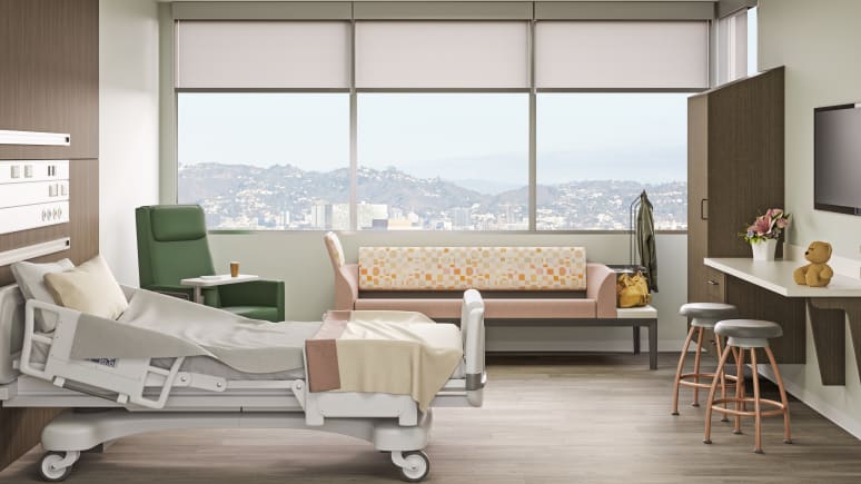 patience room with a green Empath chair, a large sofa and a medical bed.